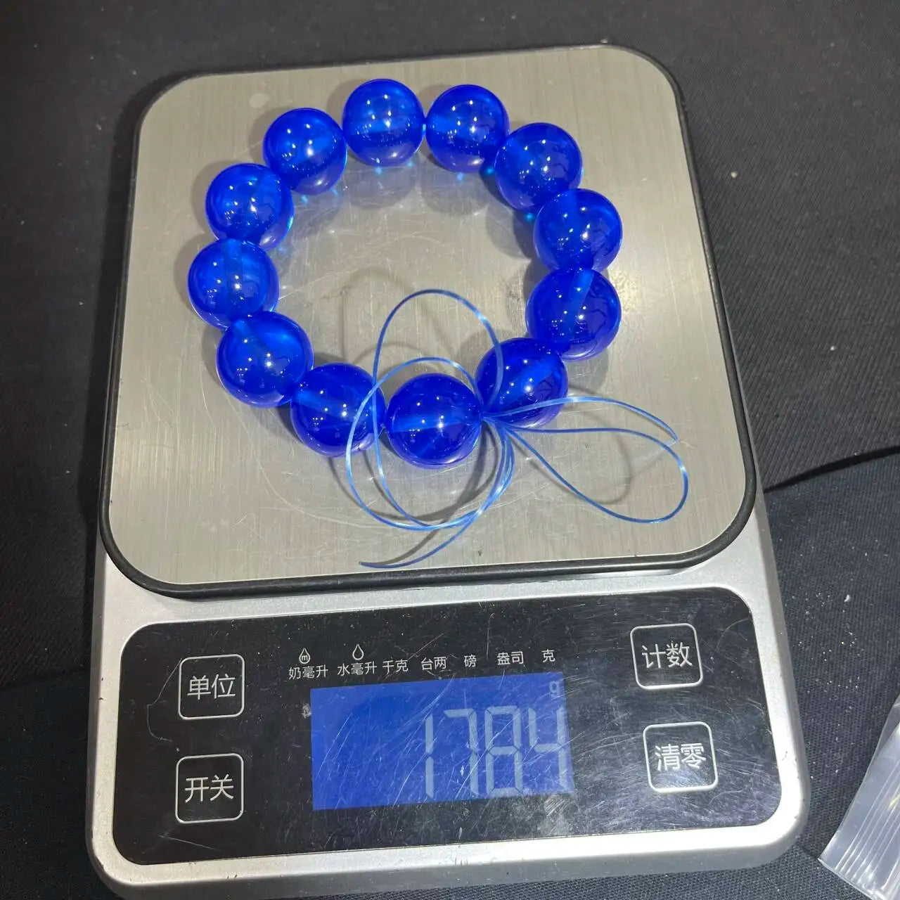 luckacco under strong light, hexagonal starlight red, starlight green, blue, pink and purple beads appear on the sapphire bracelet